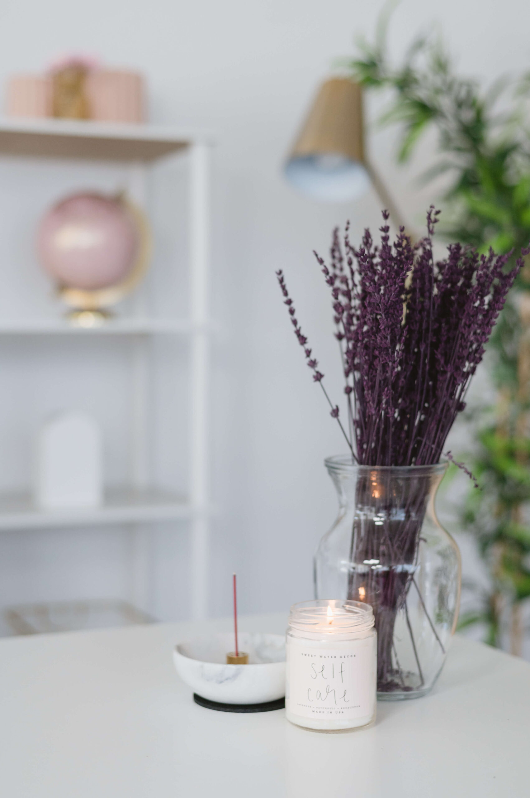 candle incense and lavender on a desk - preparing for an rtt session